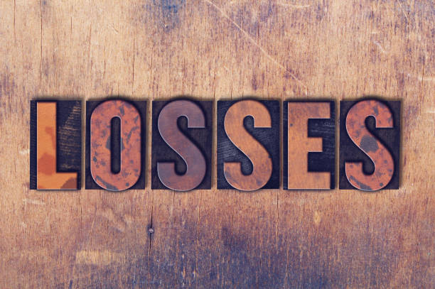 istock Losses Theme Letterpress Word on Wood Background 824334112
