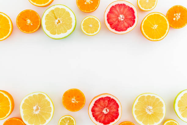 istock Citrus fruits pattern of lemon, orange and grapefruit on white background. Flat lay, top view. 824337846