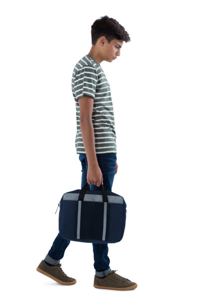 istock Teenage boy walking with bag 824338078