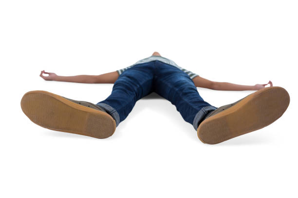 istock Teenage boy lying on white background 824338386