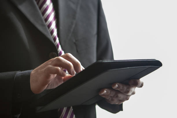 istock Midsection of a businessman using digital tablet 824345498