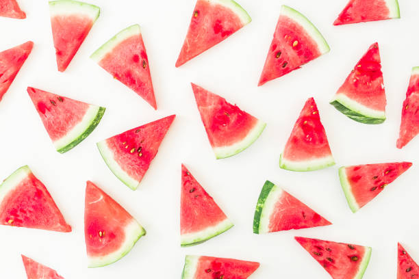 istock Pattern of sliced red watermelon on white background. Flat lay, top view 824349008
