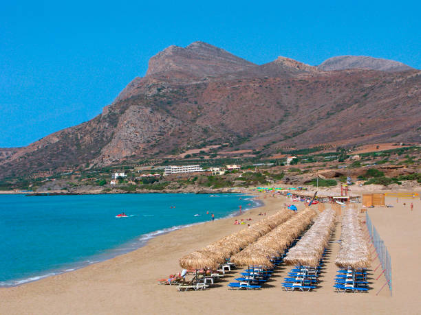 Woman wades in sea shallows, Paralia Agia Kioura, Leros