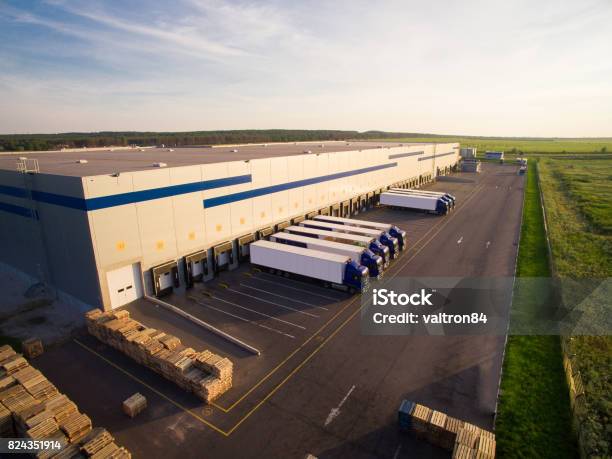 Distribution Warehouse With Trucks Of Different Capacity Stock Photo - Download Image Now