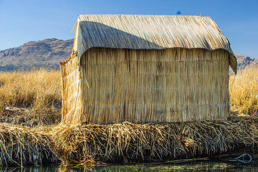 Hand made houses in Uros, artificial islands made of floating reeds, Peru, South America.