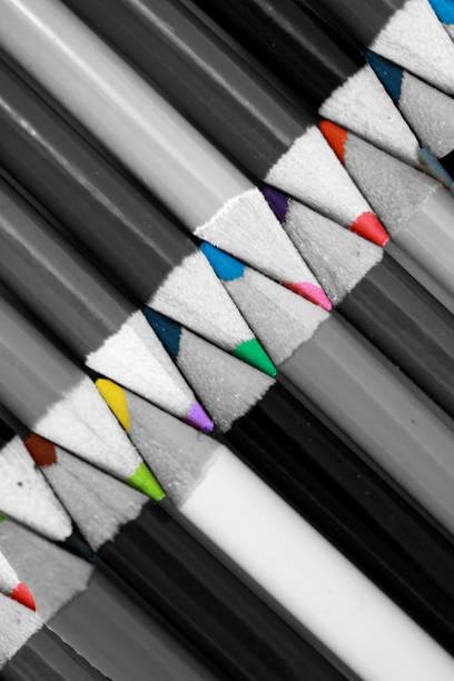 colorful pencils arranged in a different position on different backdrops and surfaces.