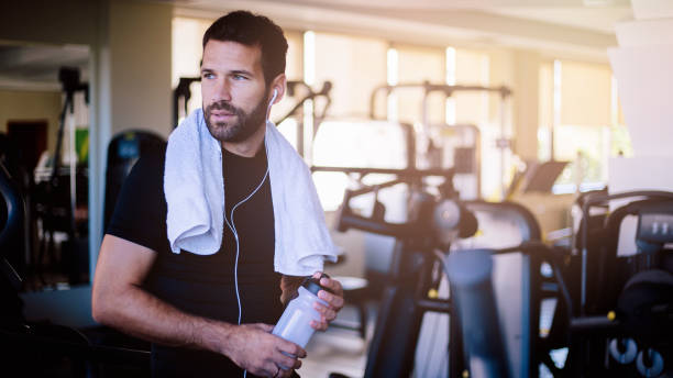 istock Handsome man in the gym having break 824363516