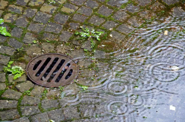 overflow of a sewer at heavy rain