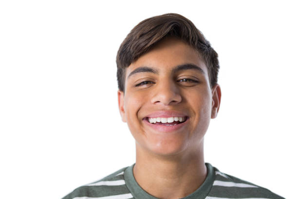 istock Smiling teenage boy against white background 824377432