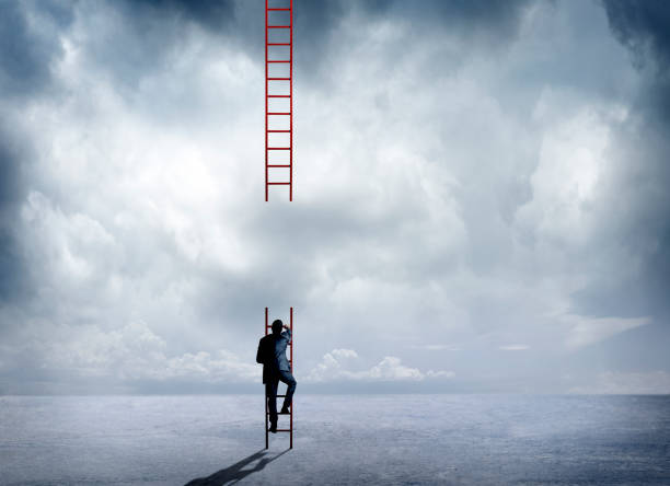 Businessman Climbing Incomplete Ladder A businessman attempts to climb a large red ladder that has a big missing segment that will prevent him from reaching his destination. incomplete stock pictures, royalty-free photos & images