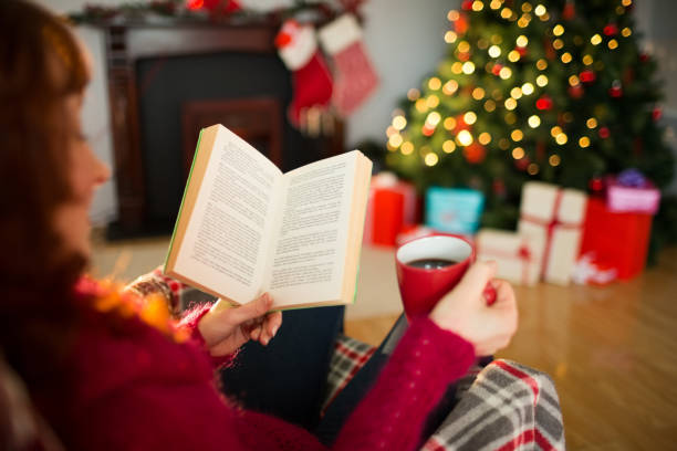 istock Red hair reading and drinking coffee at christmas 824378296