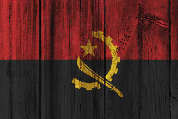 istock Angola flag painted on wooden wall for background 824385832