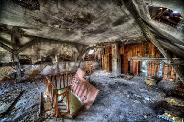 A decaying rotting interior of an old house.