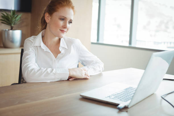 istock Thoughtful businesswoman sitting at desk 824390014