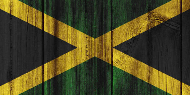 istock Jamaica flag painted on wooden wall for background 824400112