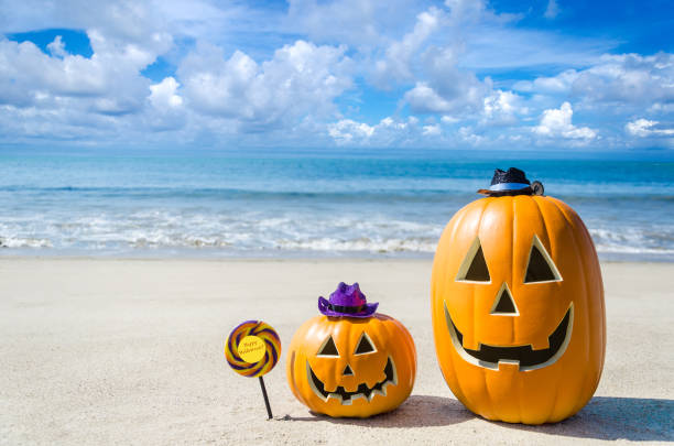istock Halloween pumpkin background on the beach 824404716