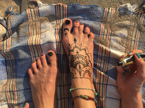 Henna tattoo paint on foot