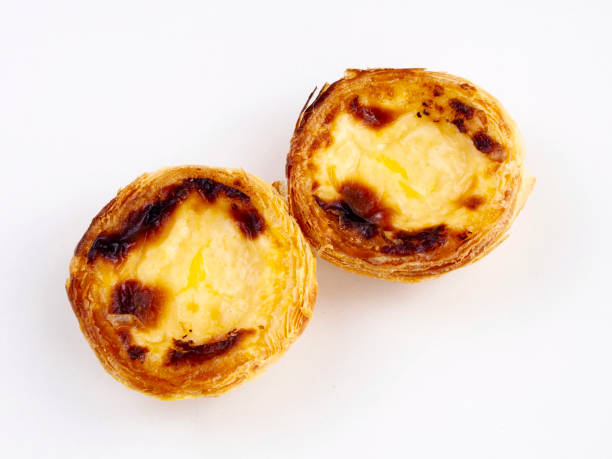istock Custard tarts on white background 824430418