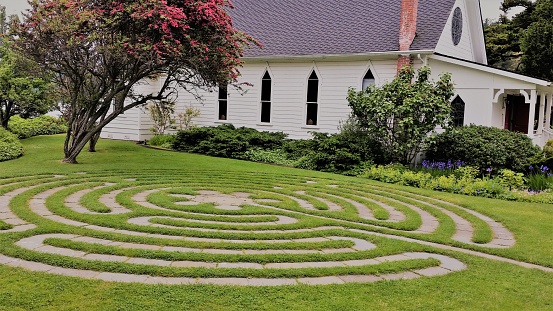 small church with lawn maze