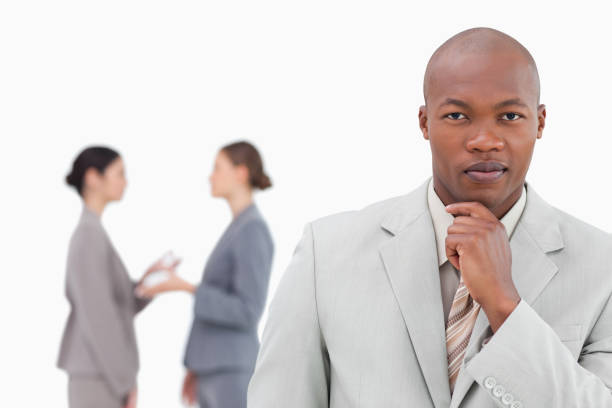 istock Thinking businessman with colleagues behind him 824559364