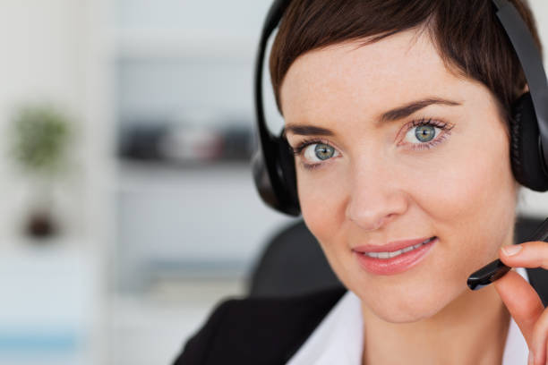 istock Close up of a cute secretary calling with a headset 824561086