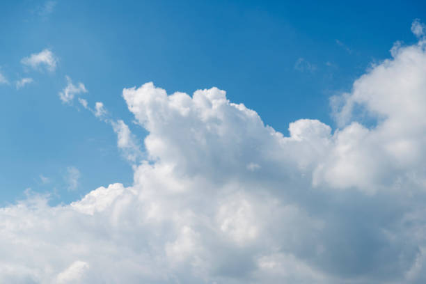 istock Blue beautiful sky with snow-white clouds of different shapes, background. 824561780