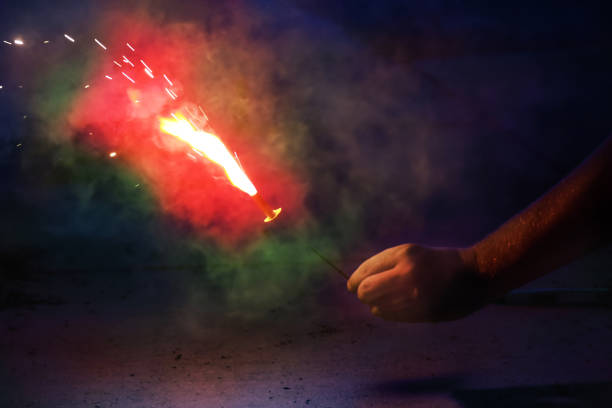 istock Man holding giant sparkler 824562524