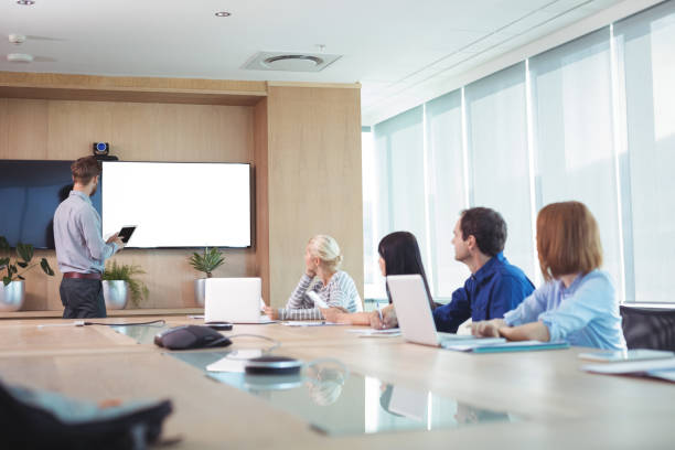 istock Business people at conference table in office 824563802