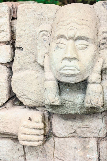 Sculpted head stone at Mayan archeological site, Copan Ruins,  Honduras, Central America