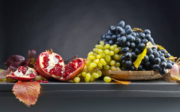 istock Blue and white grapes with pomegranate 824573980
