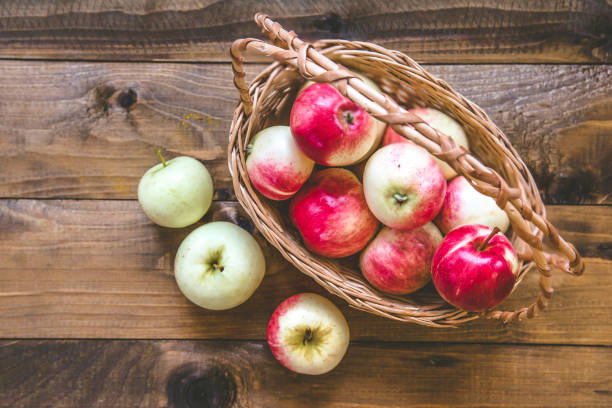 istock Fresh ripe apples in a wicker basket 824574330
