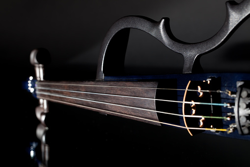 Electric violin. Modern orchestra musical instrument used in contemporary popular classical music.