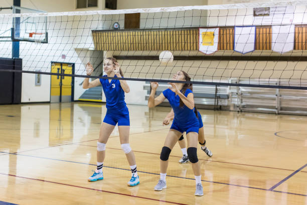 istock Girls high school volleyball game 824576396