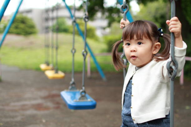 istock Japanese girl on the swing (2 years old) 824576494