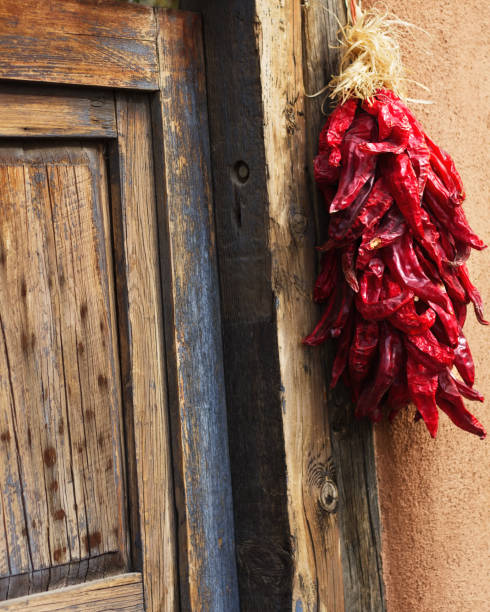 istock Santa Fe, NM: Chili Pepper Ristra, Wood Door, Adobe (Close-Up) 824576638