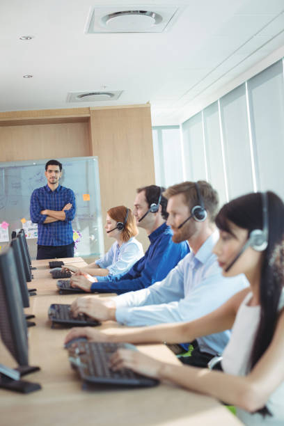 istock Supervisor with business team working at call center 824580046