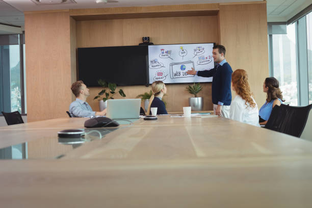 istock Businessman explaining strategy to colleagues 824580328