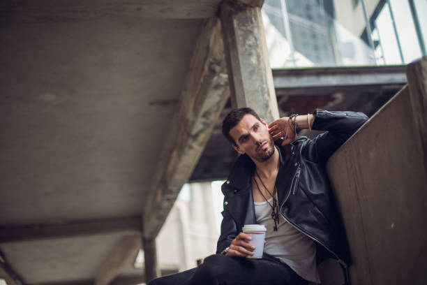 istock Attractive man having takeaway coffee outdoors 824580394