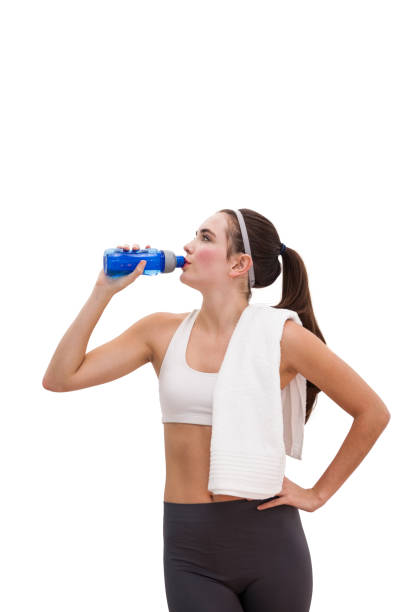 istock Fit brunette drinking from sports bottle 824580934