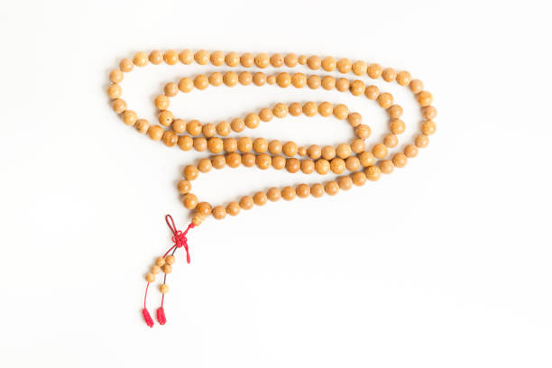 Praying and reciting wooden beads stock photo