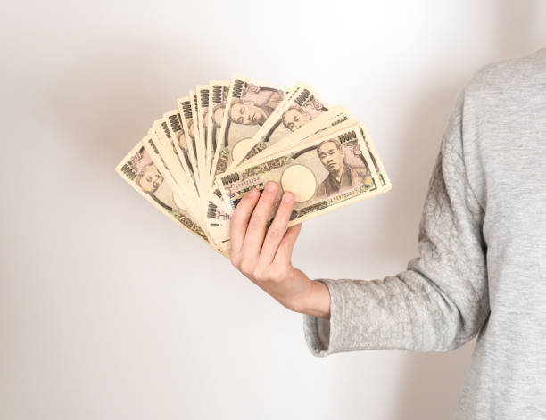 istock Woman holding big money 824583162