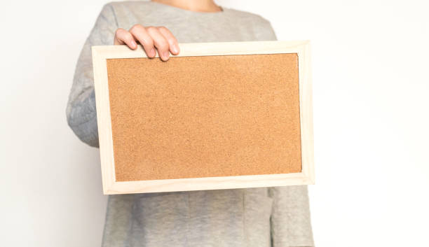 istock Woman holding a cork board 824583964