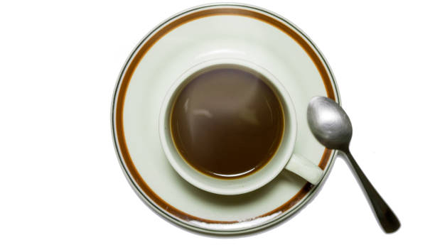 istock Cup of black coffee in dish with teaspoon 824585004