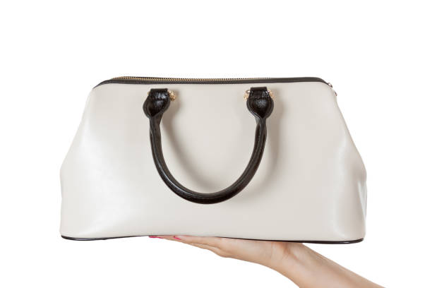 istock Woman Hand with Cream Coloured Leather Handbag. 824585716