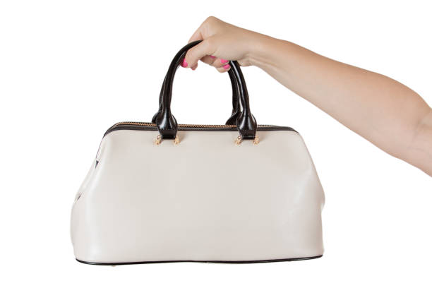 istock Woman Hand with Cream Coloured Leather Handbag. 824585788