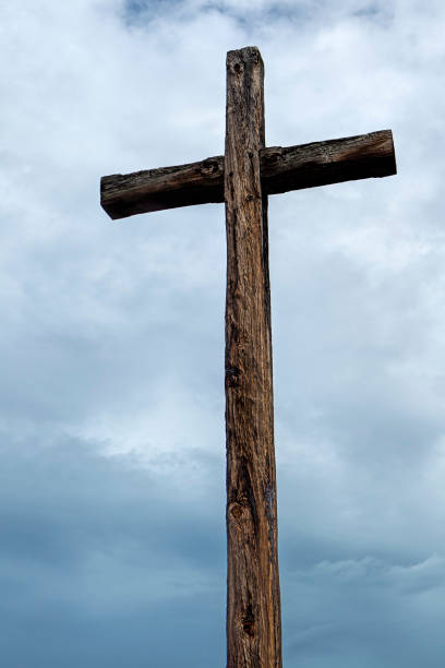 istock Old wood cross and cloudy sky. 824588294