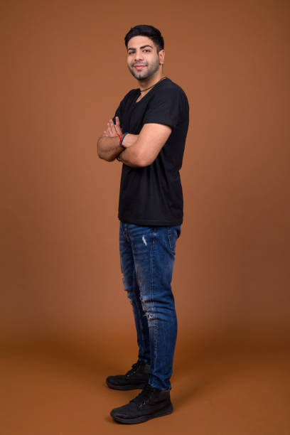 istock Studio shot of young handsome Indian man against colored background 824589616