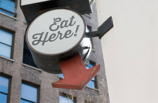 istock eat here! sign with red arrow city lifestyle 824589724