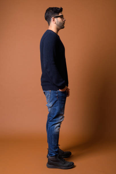 istock Studio shot of young handsome Indian man against colored background 824590006