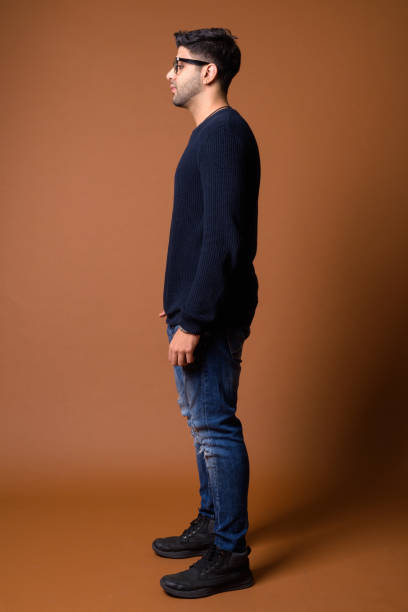 istock Studio shot of young handsome Indian man against colored background 824590014